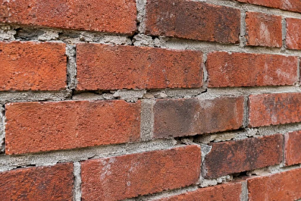 Damaged mortar joints between bricks
