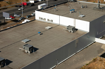 Professional commercial roof maintenance on a flat roof