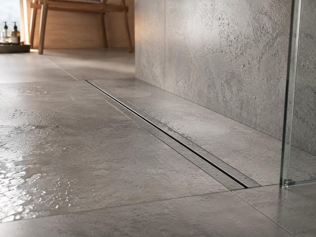 Linear drain and textured tile flooring in a curbless accessible shower.