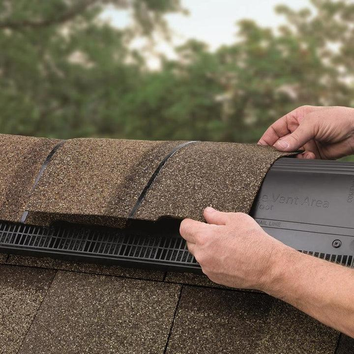 Roof ridge ventilation system installed along the peak beneath protective ridge cap shingles.